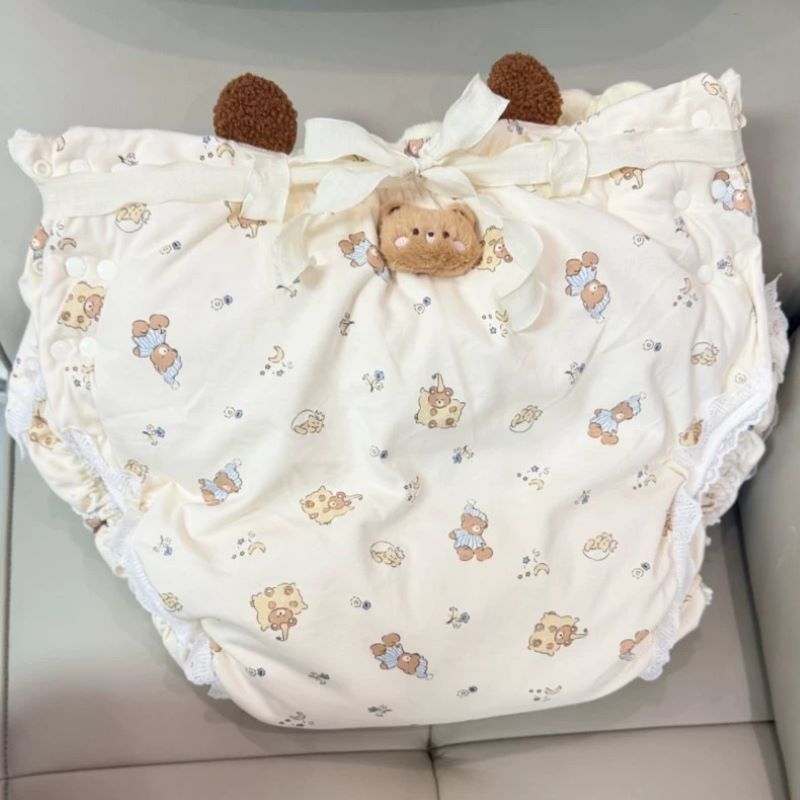 大人用コットン製、漫画柄の布製おむつ。長めの丈で厚みがあり、 - Embellish Knit のレビューと価格